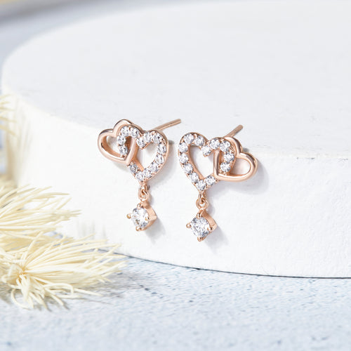 Zilveren oorbellen met dubbele hartvormige schakels