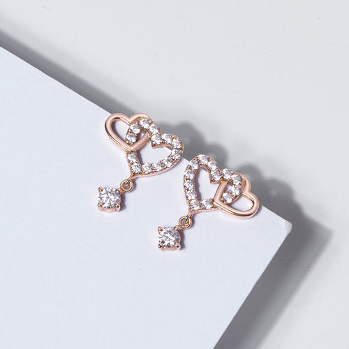 Zilveren oorbellen met dubbele hartvormige schakels