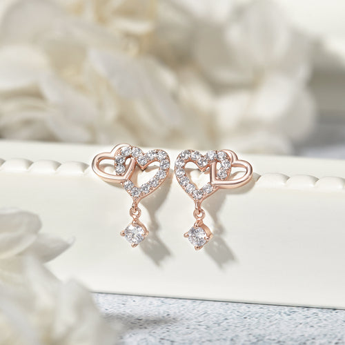 Zilveren oorbellen met dubbele hartvormige schakels