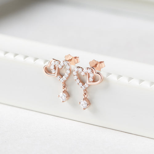 Zilveren oorbellen met dubbele hartvormige schakels